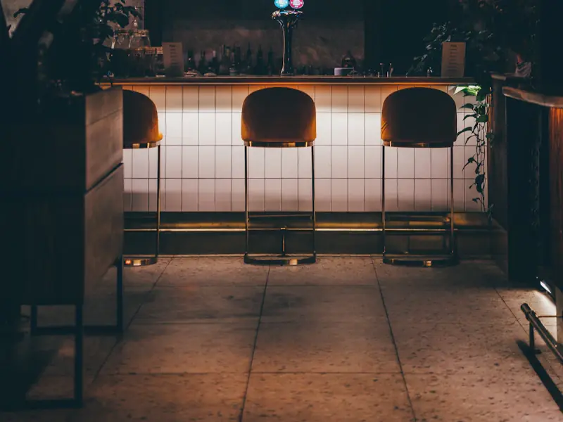 Neon-lit storefronts along a Wicker Park street at night
